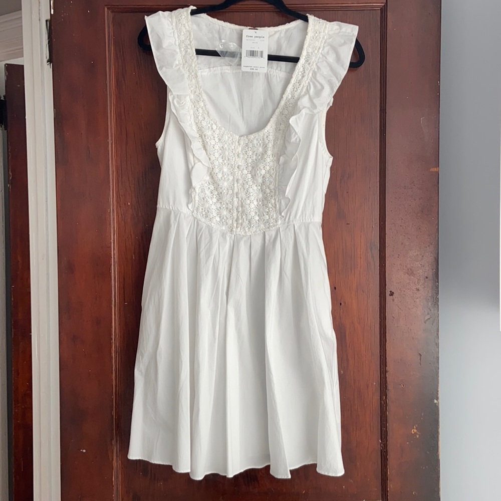 Beautiful white free people dress. never worn with tags on